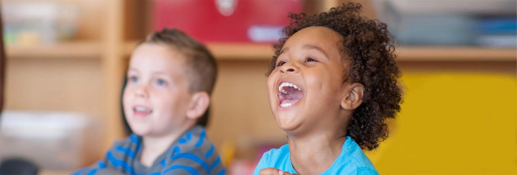  Two young children laughing