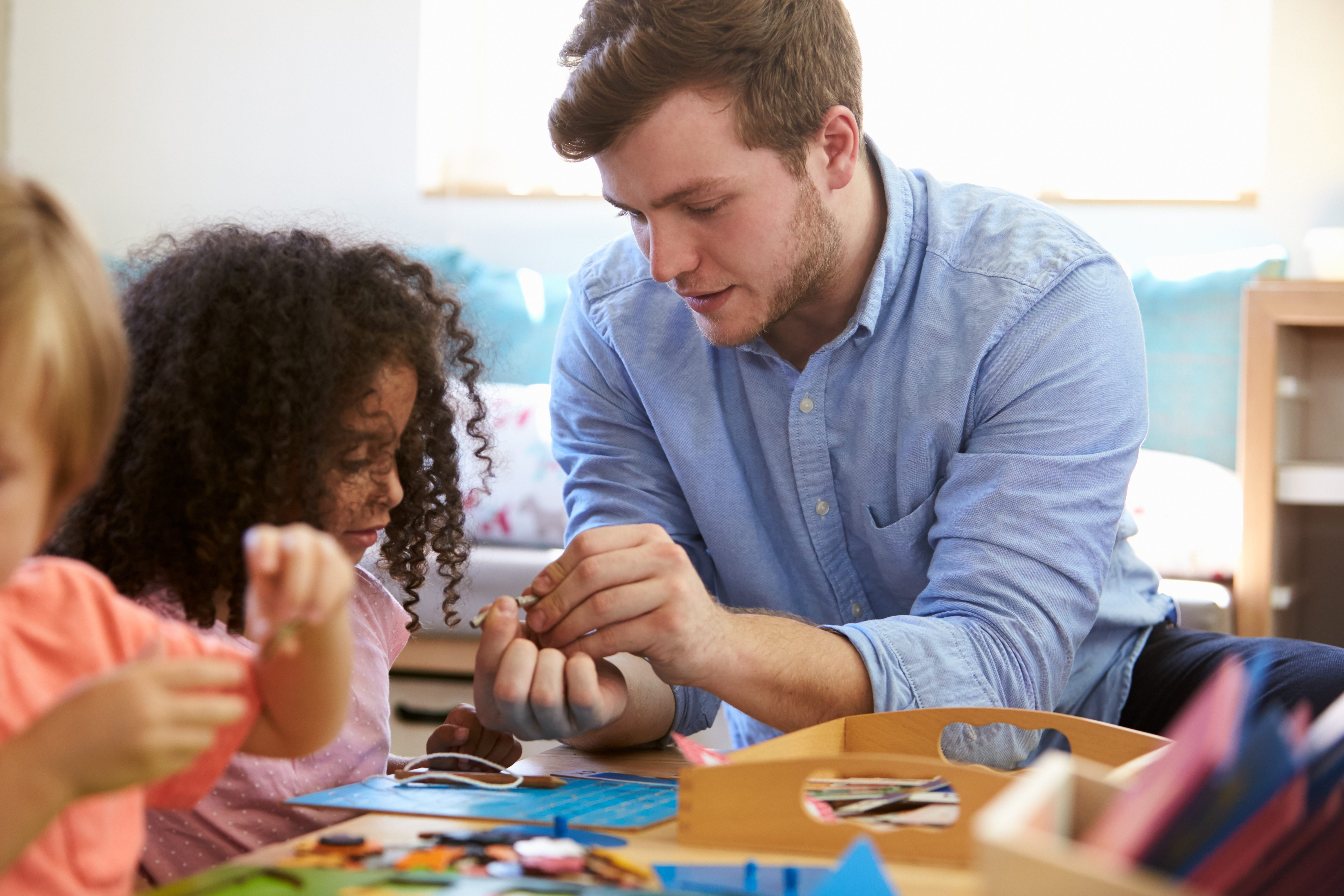 Teacher with young child