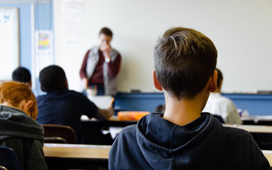 Student paying attention to teacher in class