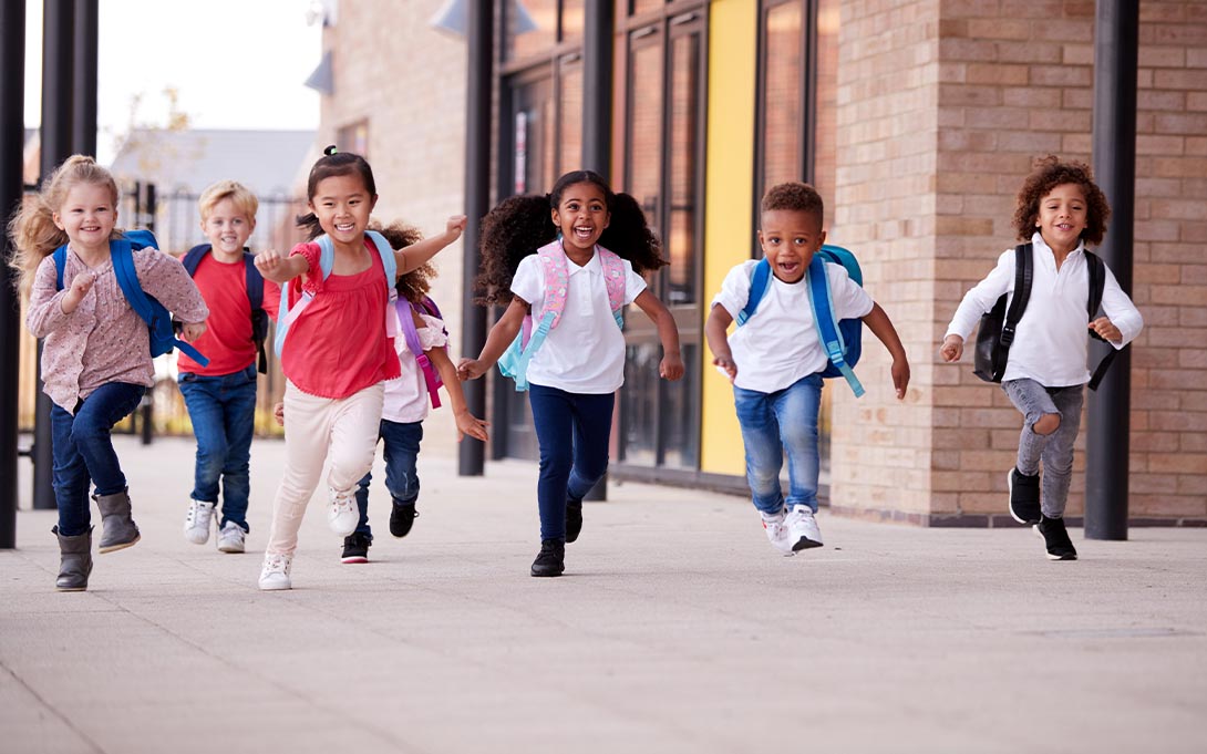 Young schoolchildren running