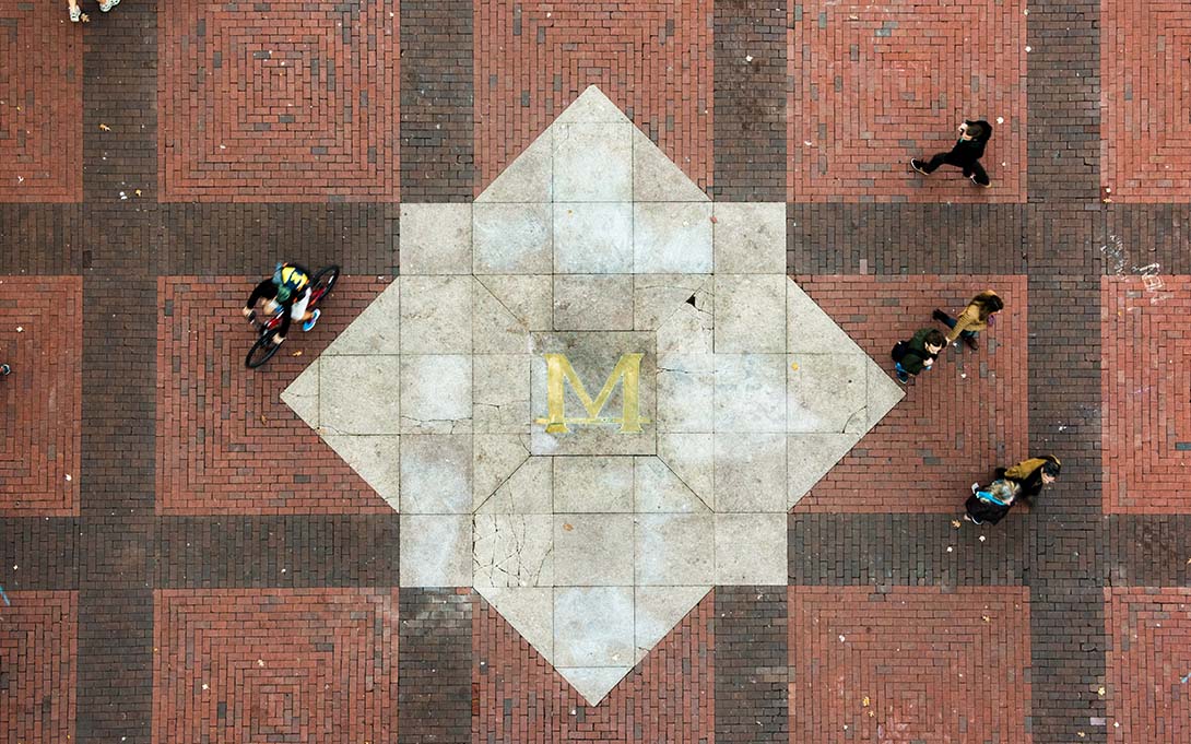 A block M on the ground on University of Michigan's campus