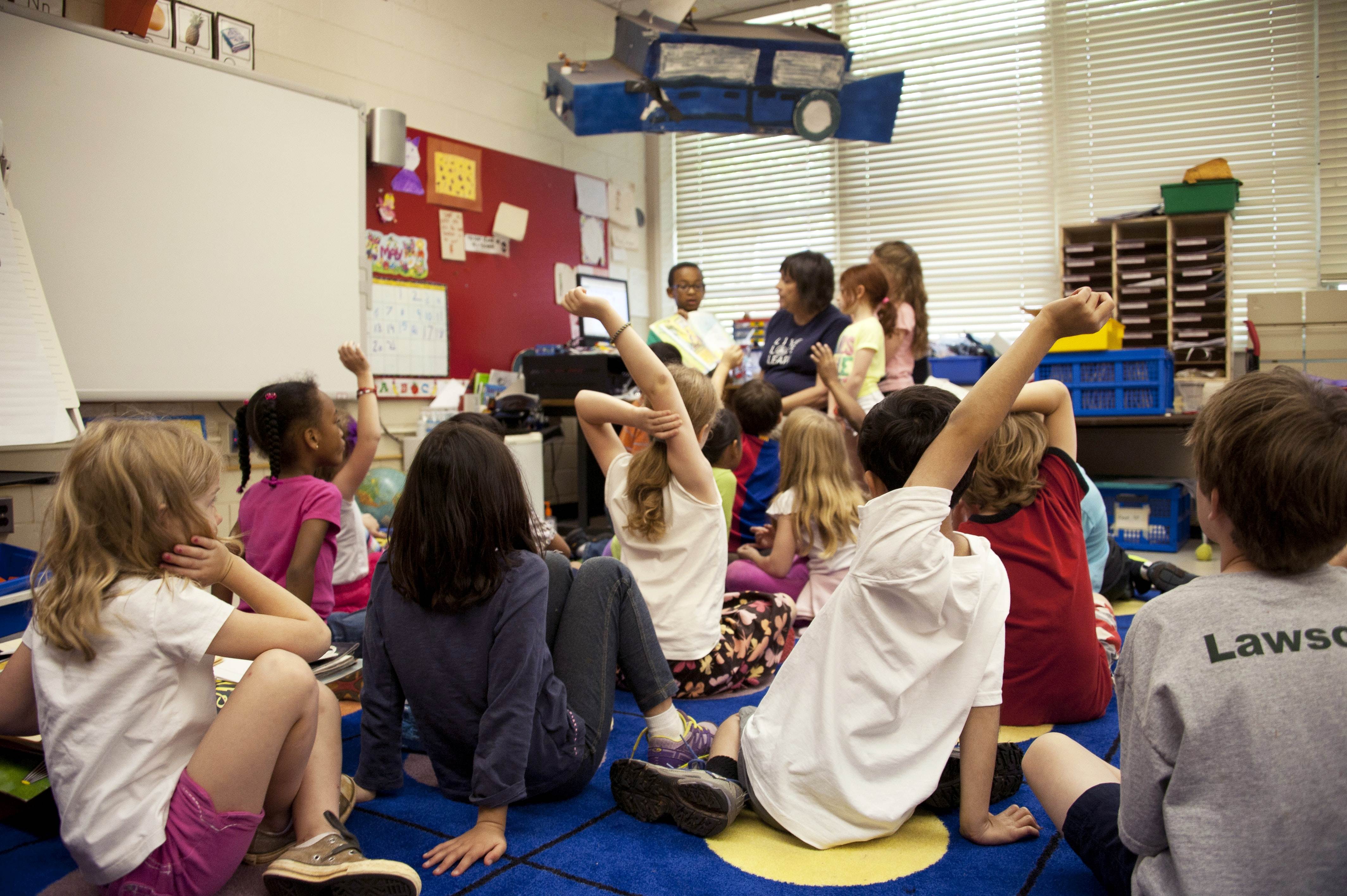 Kids on mat with teacher at the front