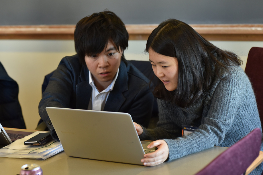 Two students working on research or project